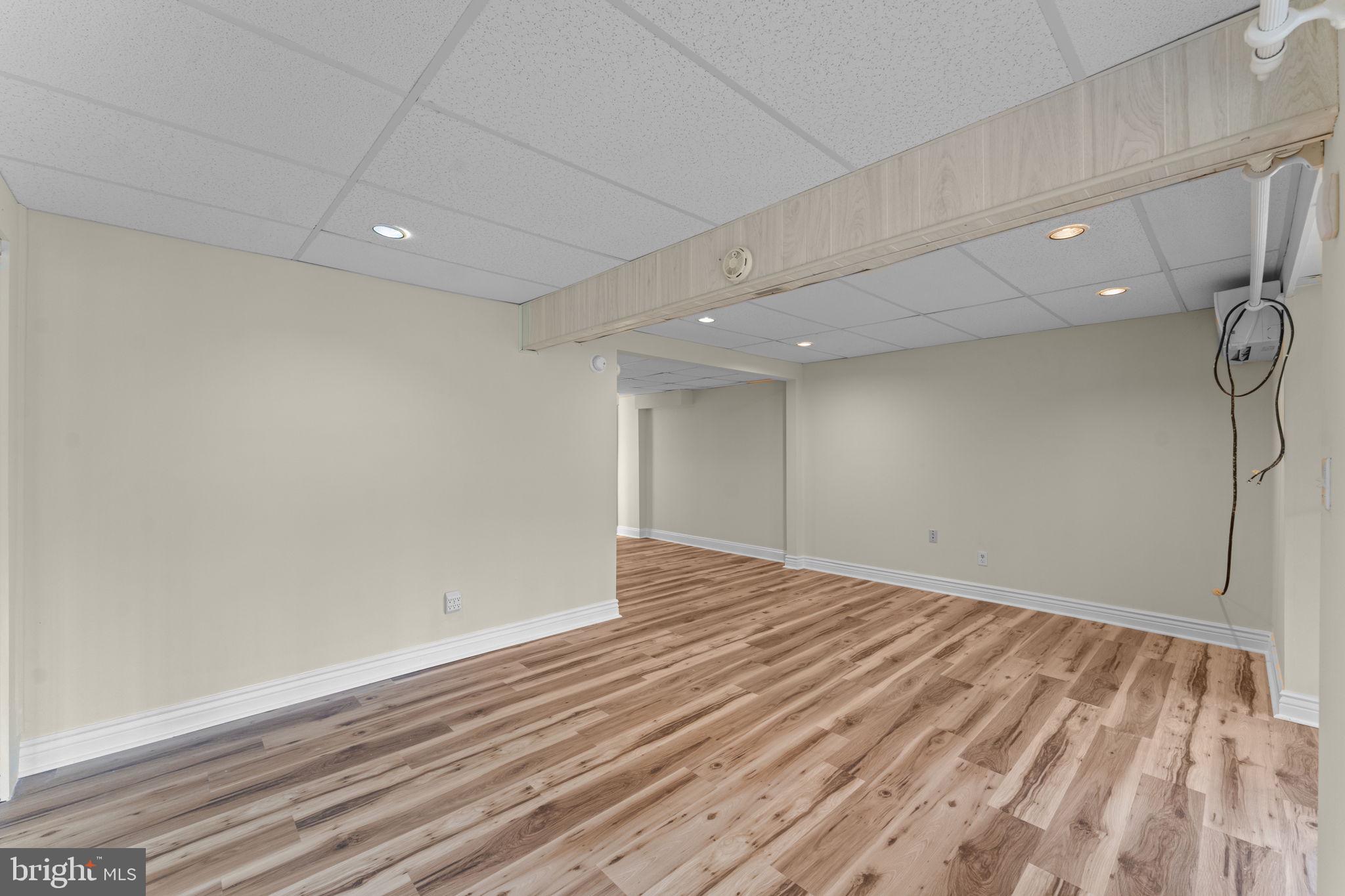 11492 Rawhide Road Lusby, MD 20657 - Photo 49 of 96 a view of an empty room with wooden floor