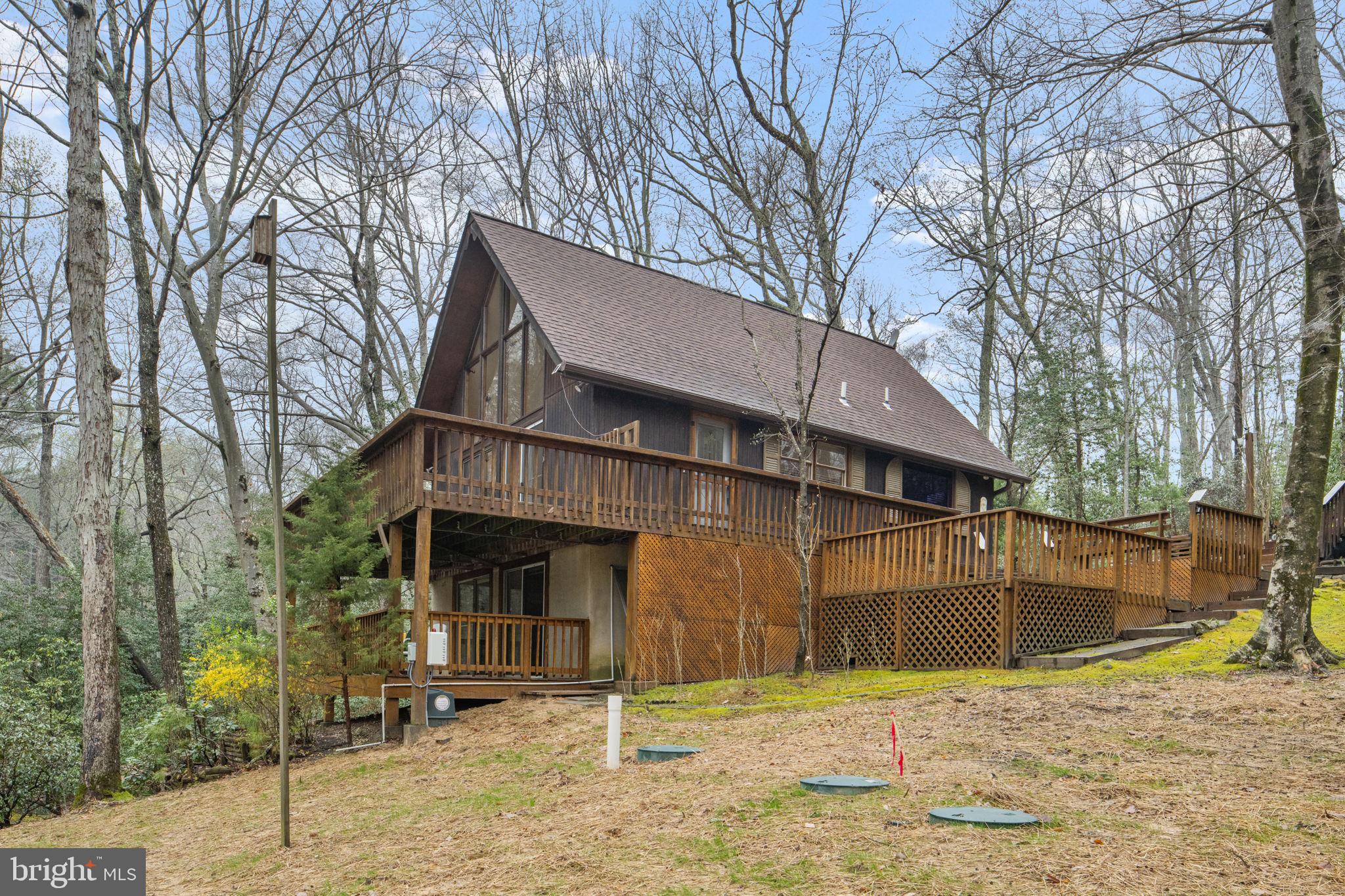 11492 Rawhide Road Lusby, MD 20657 - Photo 5 of 96 a front view of a house with a yard
