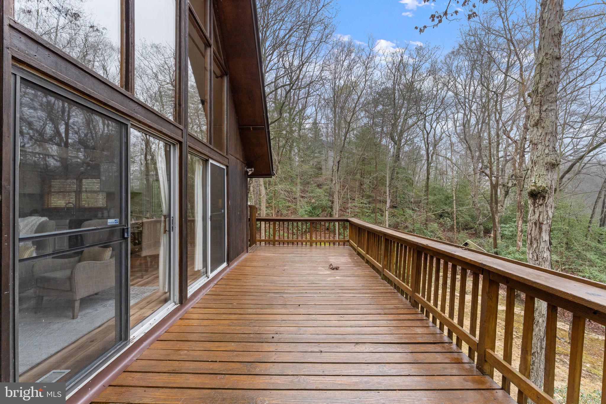 11492 Rawhide Road Lusby, MD 20657 - Photo 72 of 96 a view of balcony with wooden floor and fence