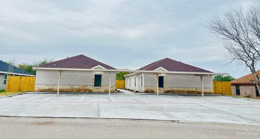1201 West Garfield Avenue, Unit 3 Alton, TX 78573 - Photo 1 of 15 a front view of a house with a yard