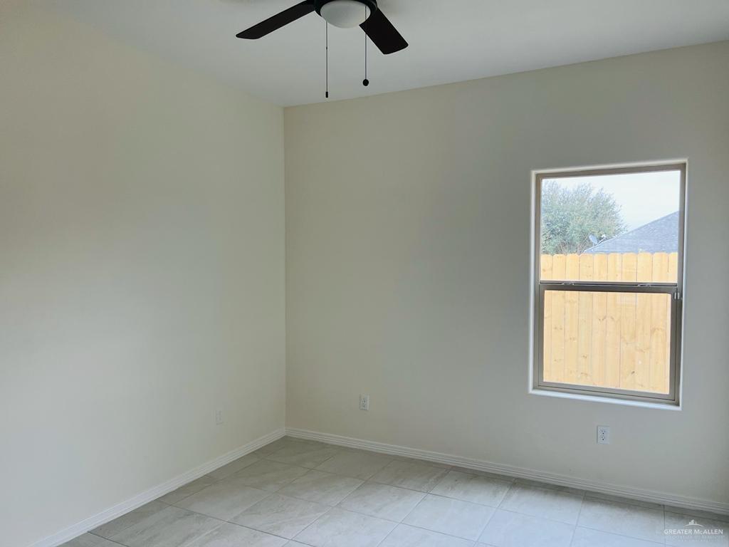 1201 West Garfield Avenue, Unit 3 Alton, TX 78573 - Photo 11 of 15 an empty room with a window