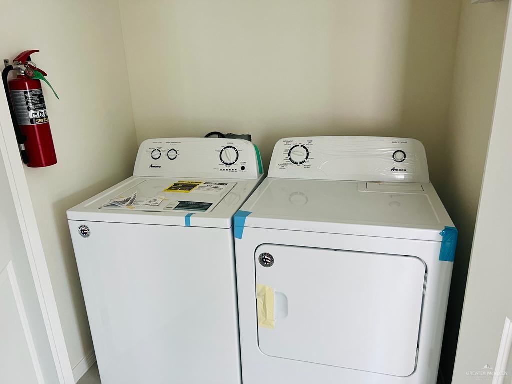 1201 West Garfield Avenue, Unit 3 Alton, TX 78573 - Photo 13 of 15 a utility room with dryer and washer