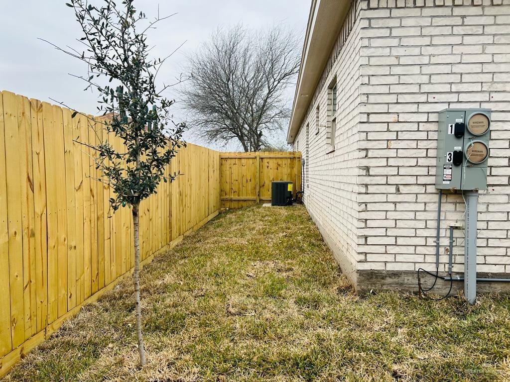 1201 West Garfield Avenue, Unit 3 Alton, TX 78573 - Photo 14 of 15 a bathroom with a sink and shower