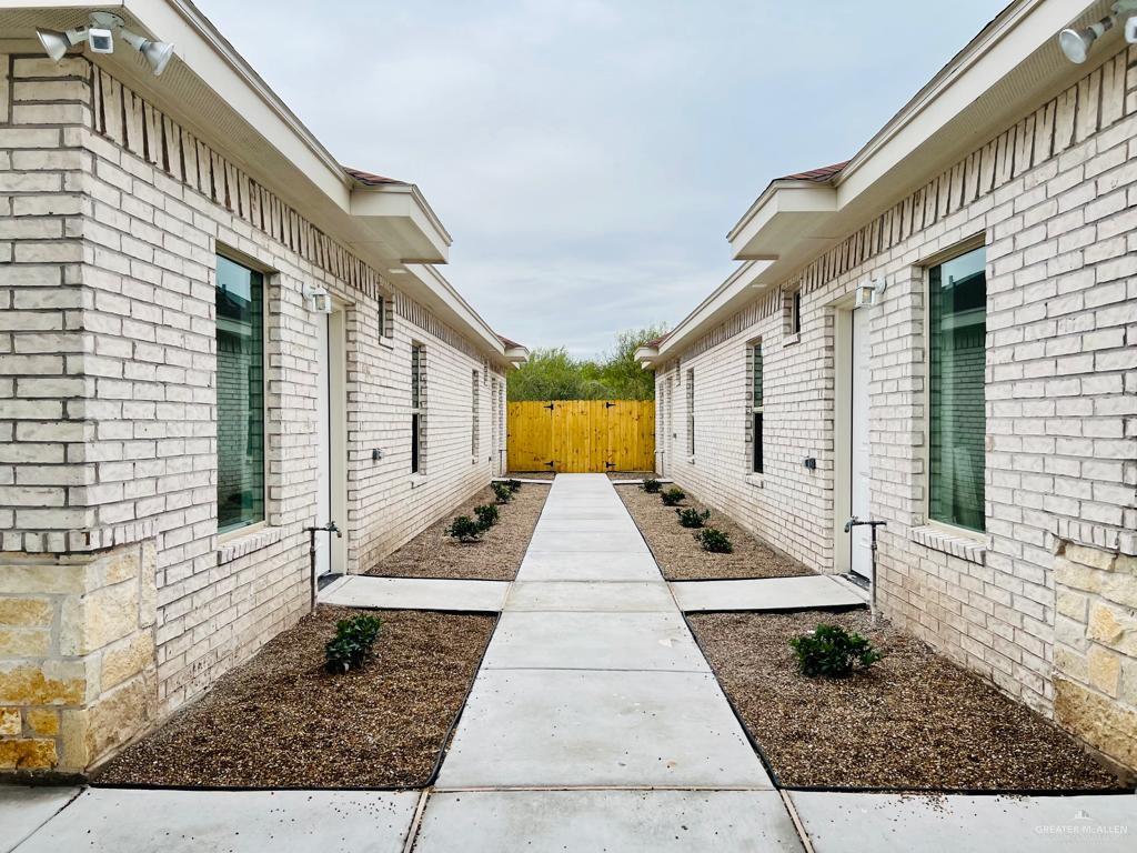 1201 West Garfield Avenue, Unit 3 Alton, TX 78573 - Photo 2 of 15 a view of a brick house with large windows