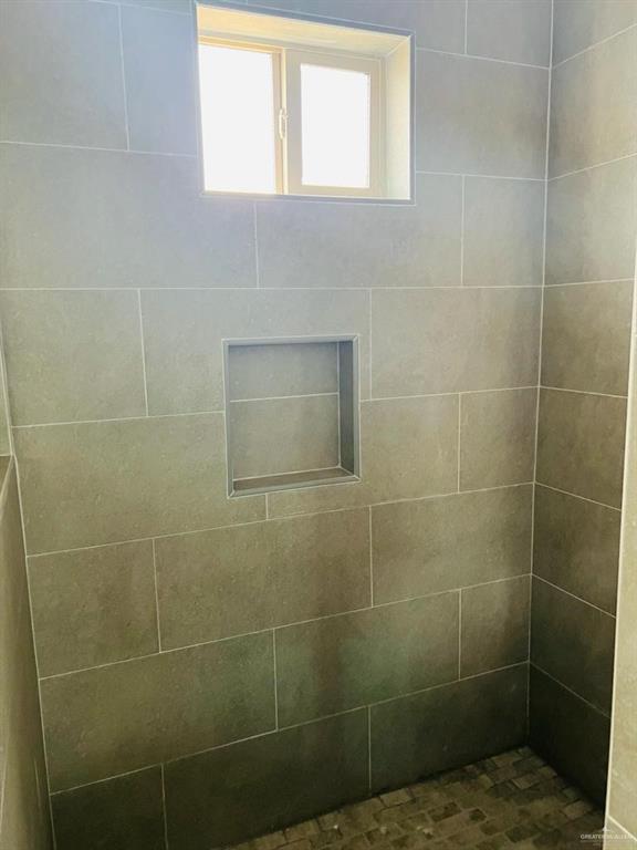 1201 West Garfield Avenue, Unit 3 Alton, TX 78573 - Photo 10 of 15 a bathroom with a shower