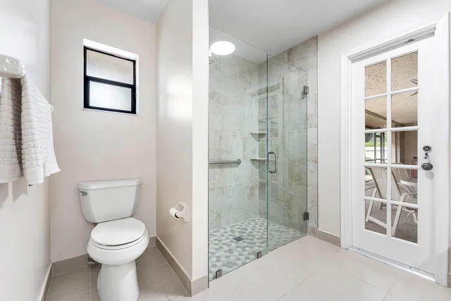 a bathroom with a sink double vanity granite and a mirror