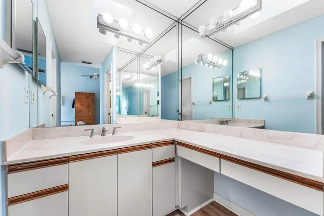 a living room with furniture a flat screen tv and a window