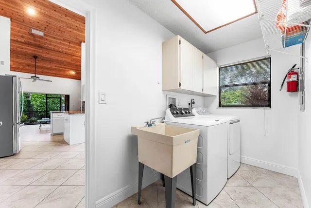 a spacious bedroom with a bed and a book shelf
