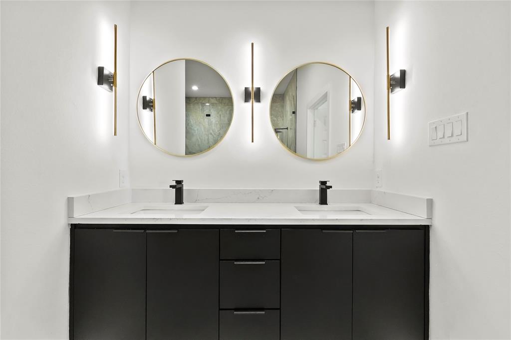 2404 52nd Street Dallas, TX 75216 - Photo 12 of 21 a bathroom with 2 sink and a mirror