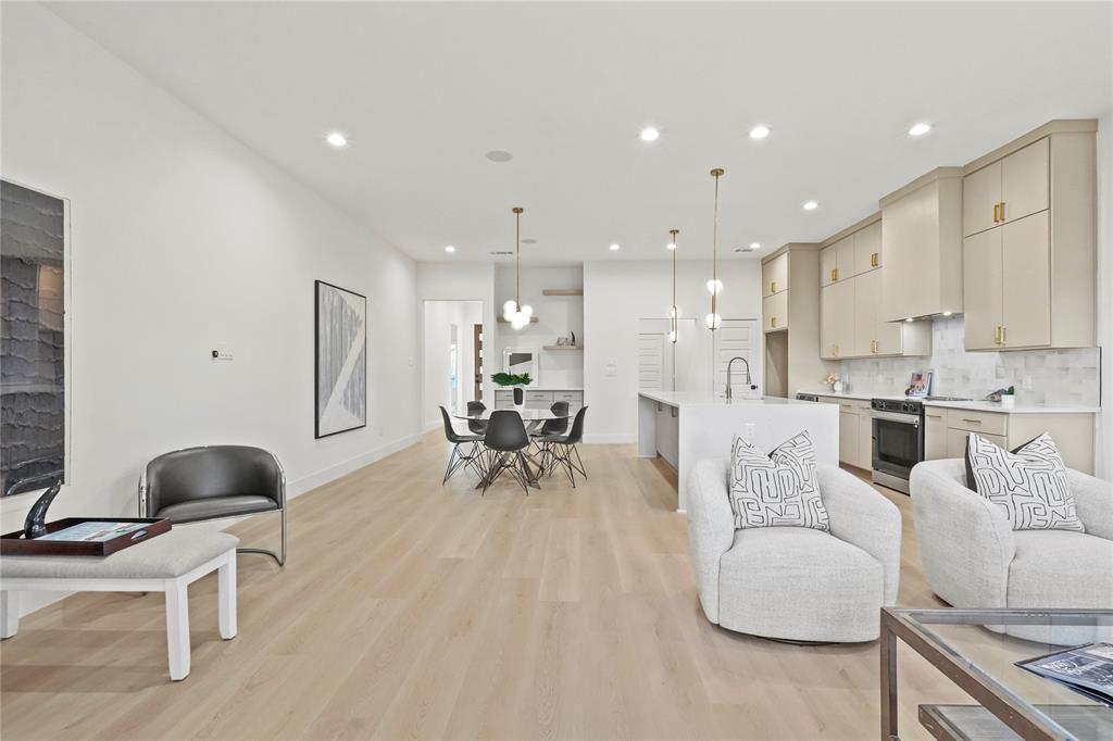 2404 52nd Street Dallas, TX 75216 - Photo 6 of 21 a living room with furniture and a dining table with kitchen view