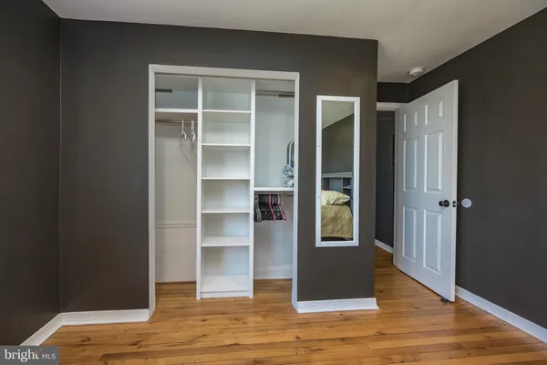 a bathroom with a sink vanity and a mirror