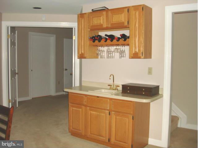 110 South River Landing Road, Unit 110 Edgewater, MD 21037 - Photo 26 of 30 a bathroom with a sink a vanity and a mirror