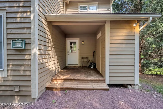a view of backyard with utility room