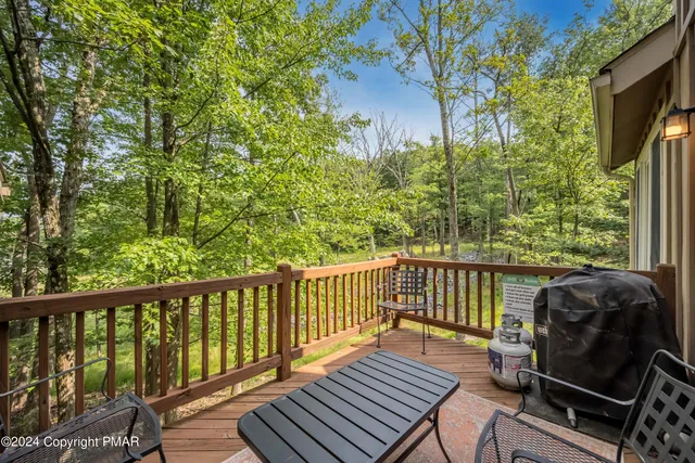 a view of a balcony with wooden floor