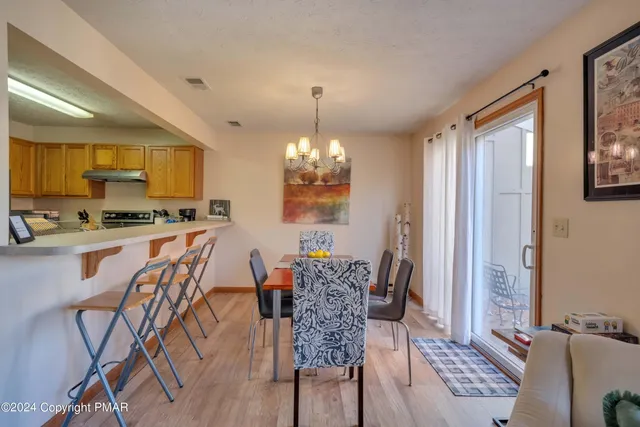 a dining room with furniture and window
