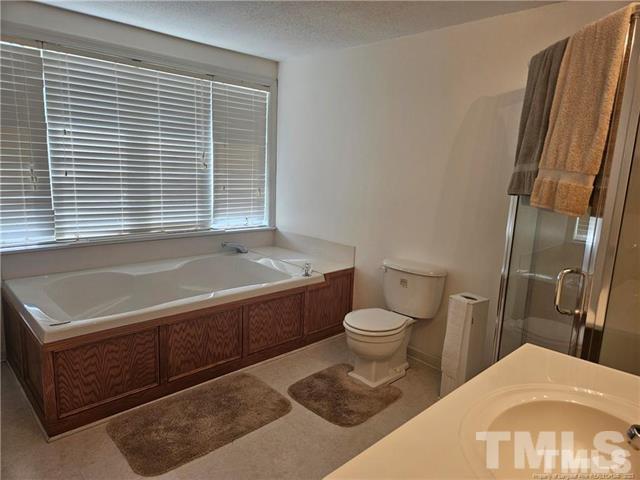 2164 Ray Road Spring Lake, NC 28390 - Photo 8 of 17 a bathroom with a tub toilet and sink