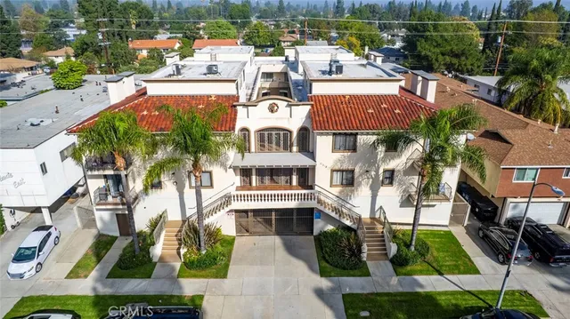 an aerial view of a house with a yard