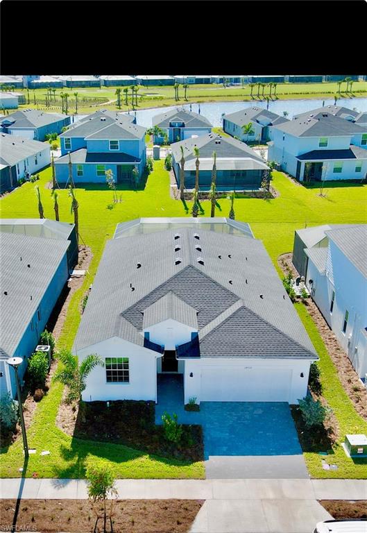 an aerial view of a house with a swimming pool