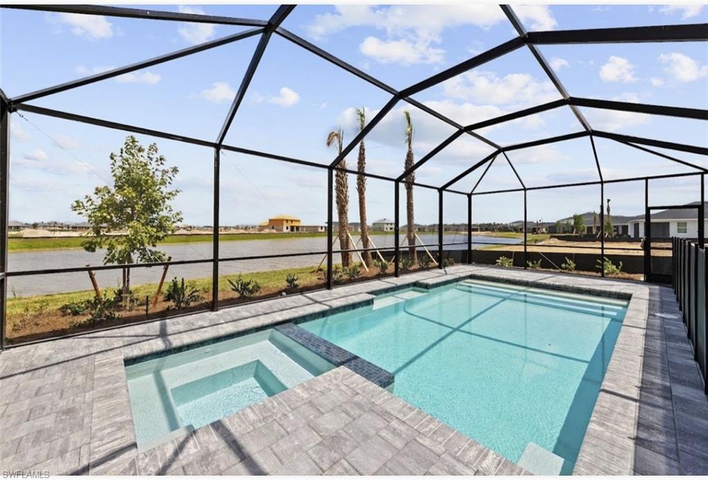 15031 Bluewater Road Babcock Ranch, FL 33982 - Photo 2 of 3 a view of a swimming pool with a yard from a balcony