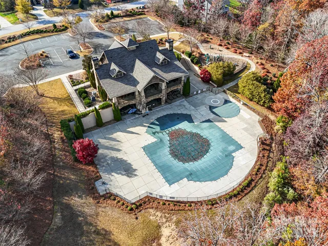 an aerial view of a house with a swimming pool