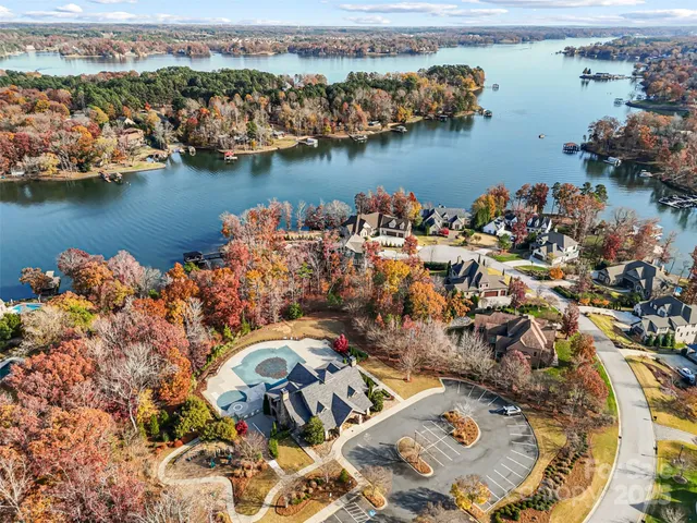 an aerial view of a house with a lake view