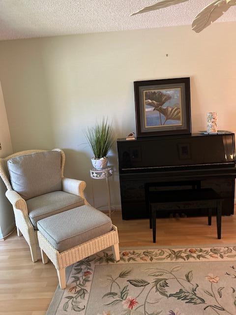 1955 Southwest Palm City Road, Unit H Stuart, FL 34994 - Photo 10 of 22 a living room with furniture and a potted plant