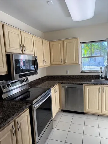 a kitchen with a stove and a sink