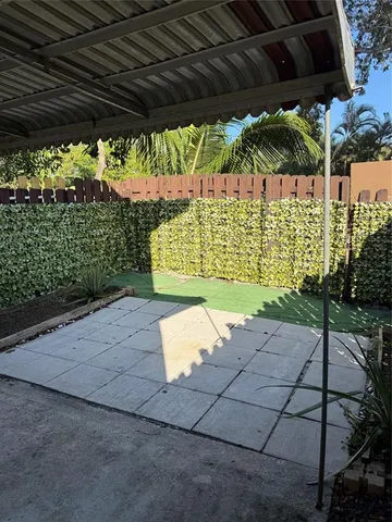 a view of backyard with a outdoor seating