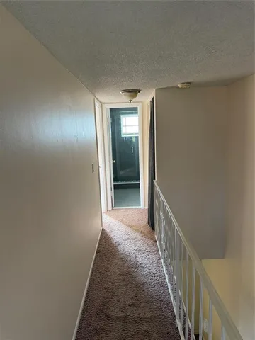 a view of a livingroom with a ceiling fan and window