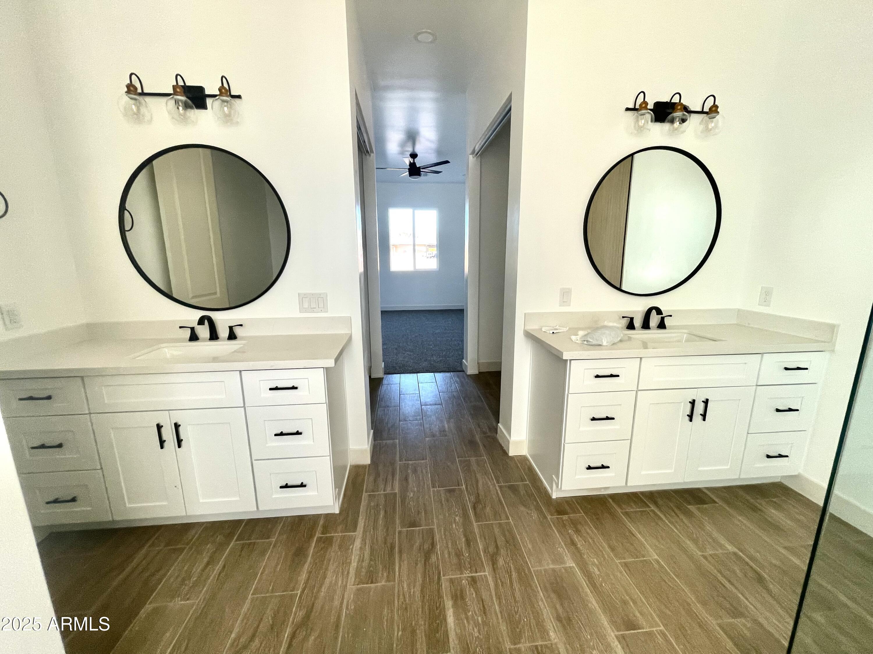 947 North Warner Drive Apache Junction, AZ 85120 - Photo 18 of 26 a bathroom with a double vanity sink mirror and a mirror