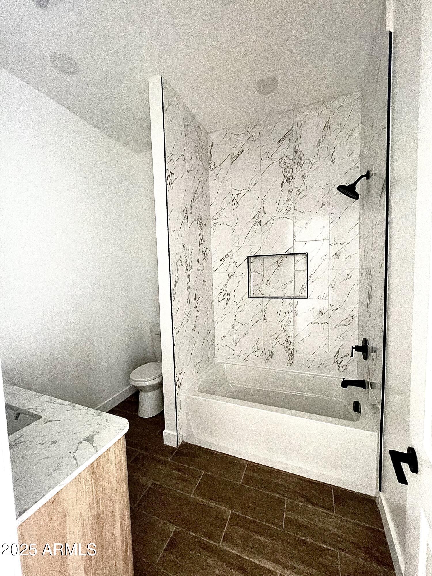 947 North Warner Drive Apache Junction, AZ 85120 - Photo 22 of 26 a bathroom with a bathtub and shower