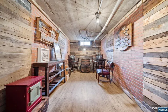 a front view of a house with a yard covered with snow