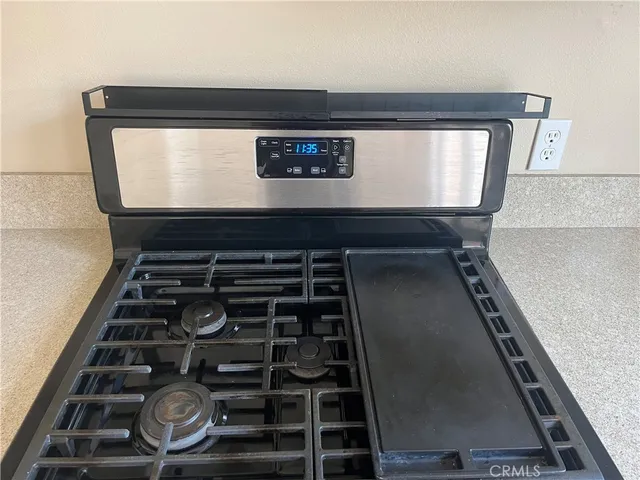 a view of a sink a window and a kitchen