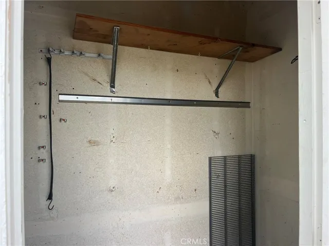 a view of a livingroom with a ceiling fan and window