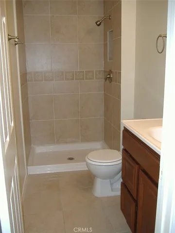 a bathroom with a glass shower door
