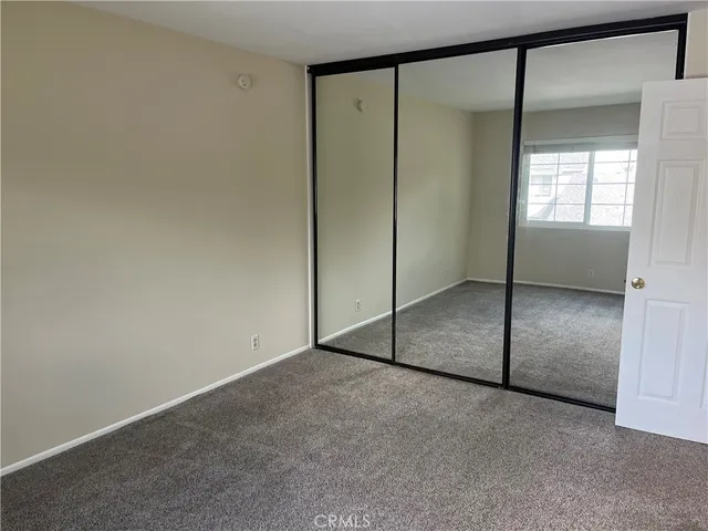 a bathroom with a shower a toilet and a sink