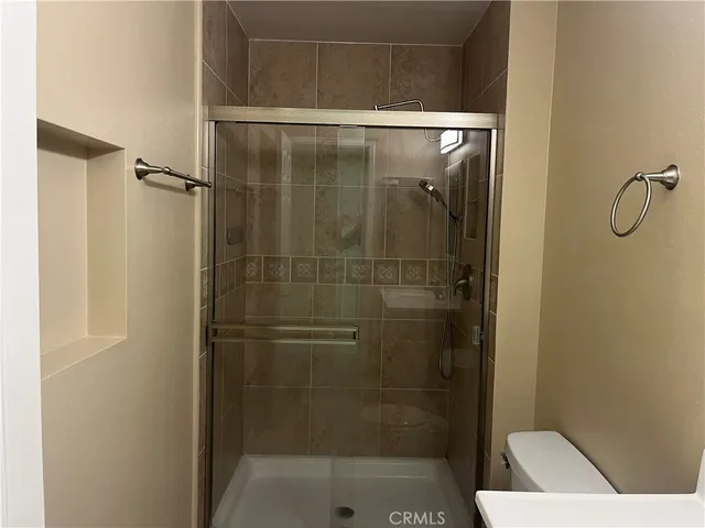 a view of a street with large trees