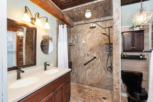 a bed in a bedroom next to a window