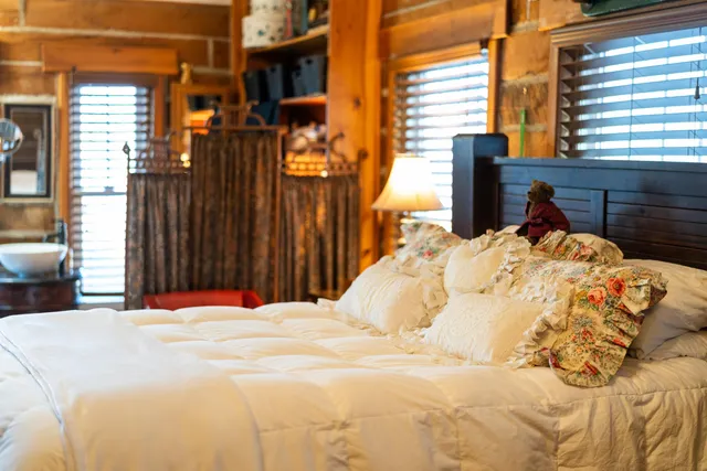 a bed room with a bed and a table