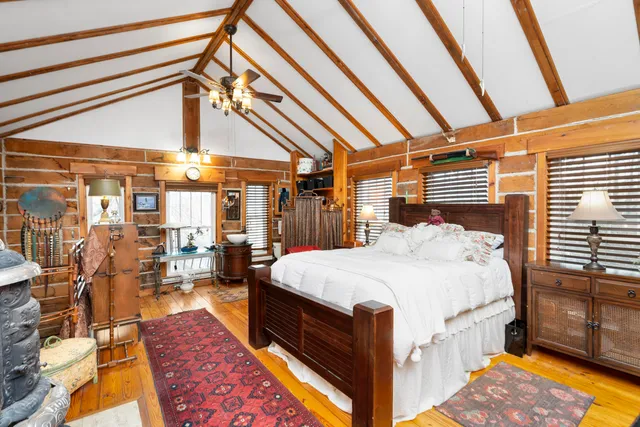 a bed room with a bed and a table