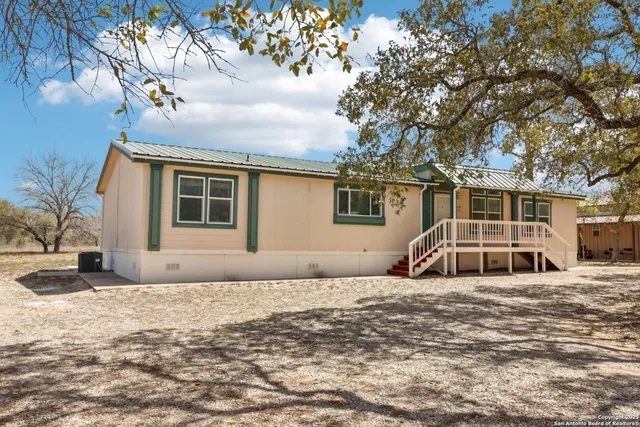 a view of a house with a snow in the yard
