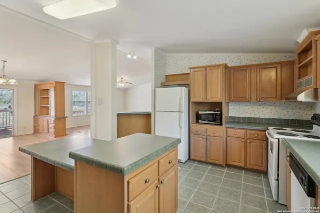 a view of room with window and wooden floor