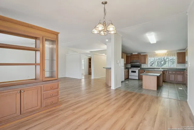 a bathroom with a double vanity sink mirror and bathtub