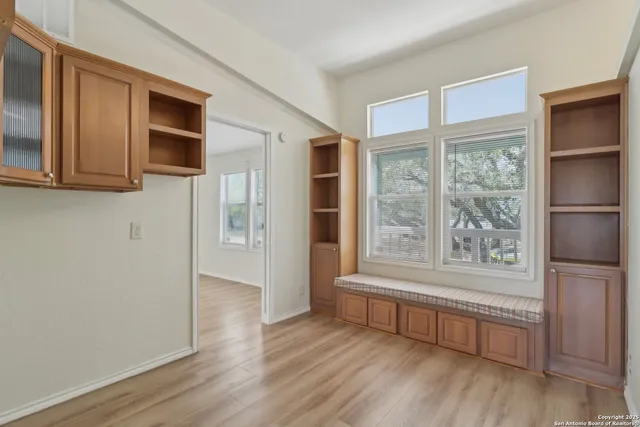 a white bath tub sitting next to a white toilet