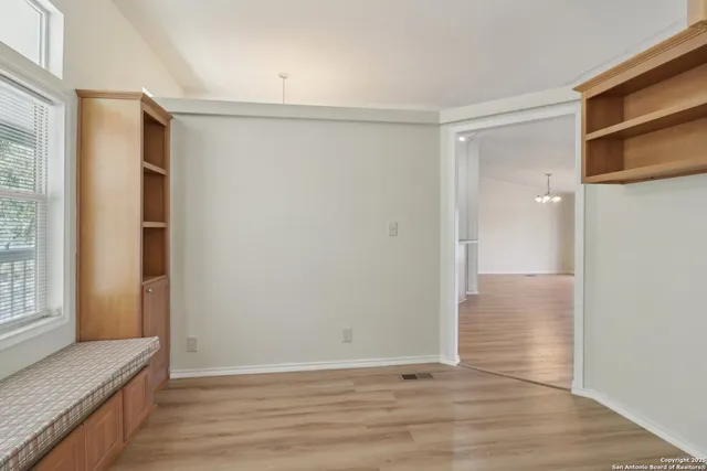 a en suite bathroom with a tub sink and mirror