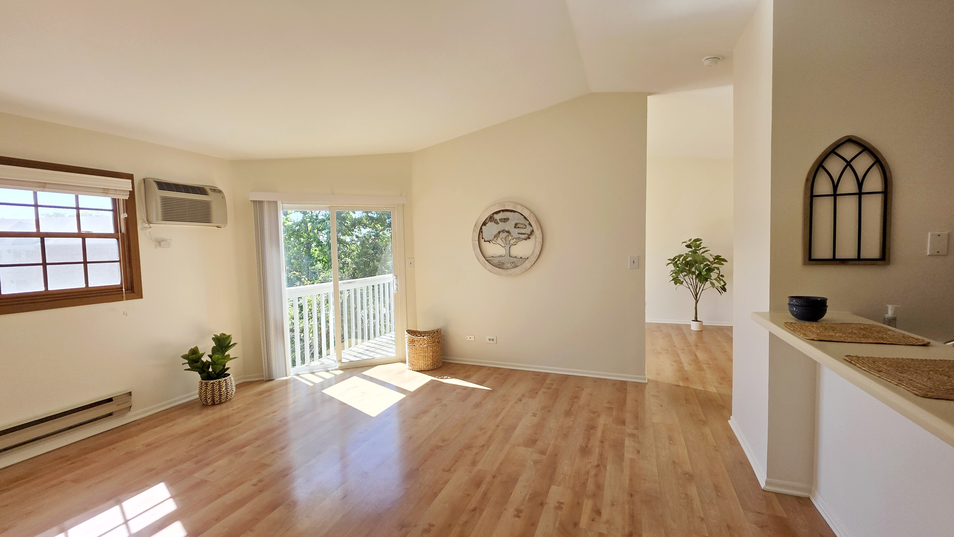 4302 West Shamrock Lane, Unit 3C McHenry, IL 60050 - Photo 2 of 20 a view of a kitchen with wooden floor and natural light