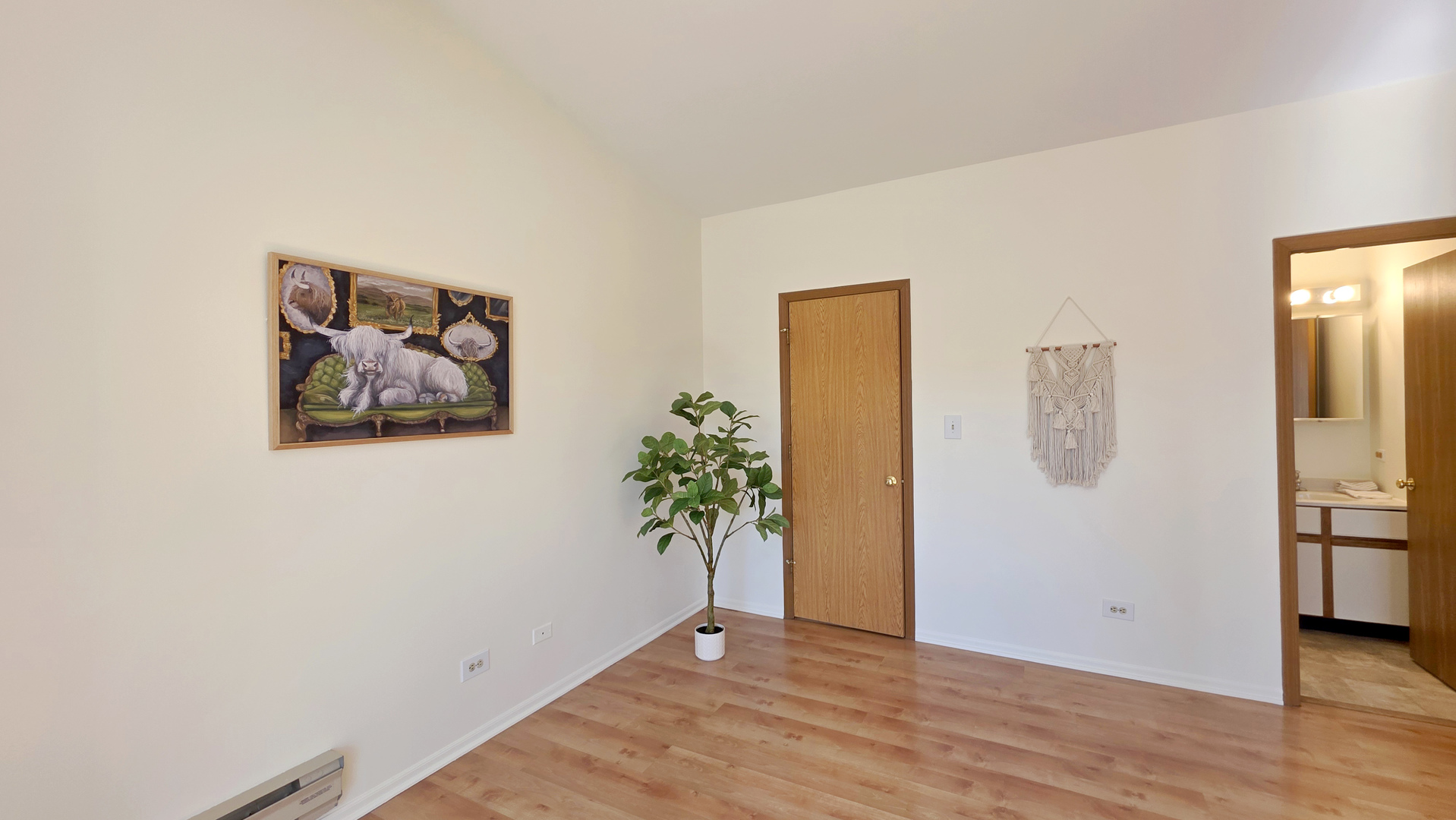 4302 West Shamrock Lane, Unit 3C McHenry, IL 60050 - Photo 10 of 20 an empty room with window and wooden floor