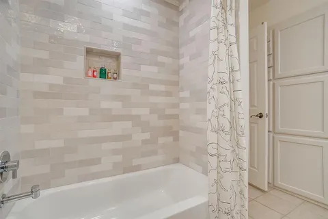 a close up of a bathtub curtain