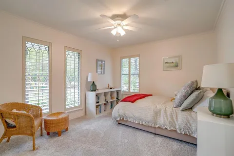 a bed room with furniture and a window