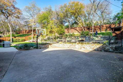 a view of road with large trees